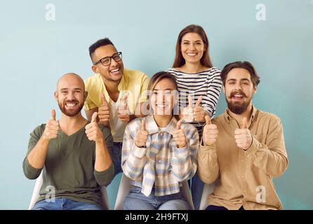 Group of asian happy students with thumbs up Stock Photo - Alamy