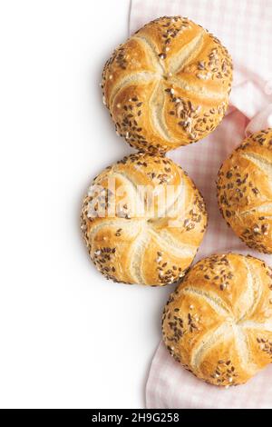 Baked french bun with seeds isolated on white background. Stock Photo