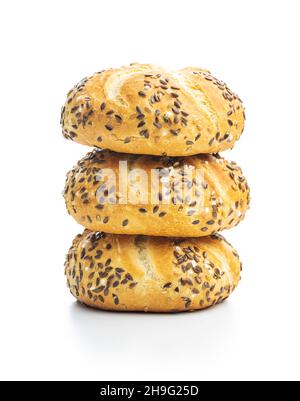 Four baked french buns with seeds isolated on white background. Stock Photo