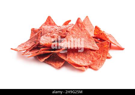 Salted tortilla chips triangle with red beet flavor isolated on white background. Stock Photo