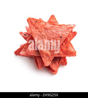 Salted tortilla chips triangle with red beet flavor isolated on white background. Stock Photo