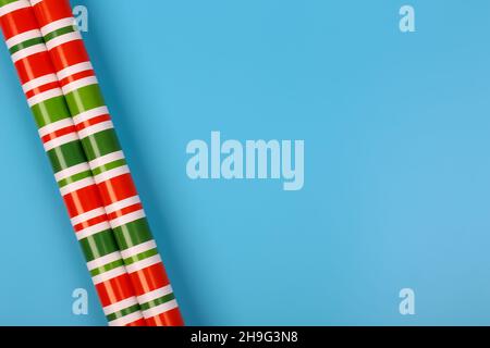 gift wrapping paper on a blue background. minimalistic christmas scandy background with empty place for text. top view, flat style Stock Photo
