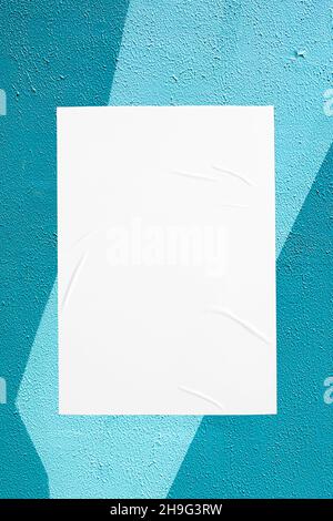 teal mint urban wall with glued poster Stock Photo
