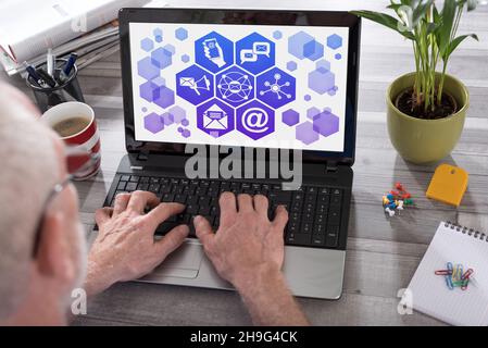 Email marketing concept shown on a laptop used by a man Stock Photo