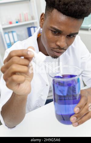 a male scientist doing experiments Stock Photo