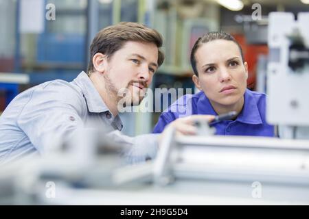 young attractive students of mechatronics working on project Stock Photo