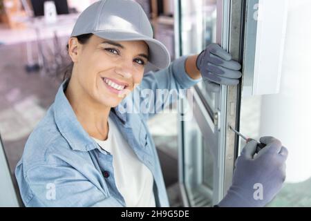 portrait of female window fitter at work Stock Photo