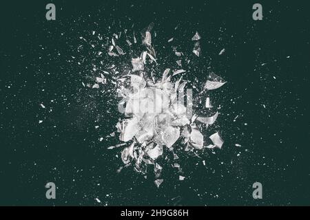 abstract image of a glass explosion on a dark background. Stock Photo