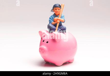 Young Boy with Piggy Bank Savings Stock Photo