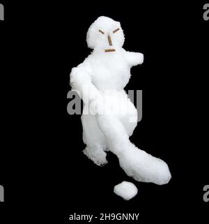 A snowman with a bandy, severe-looking (goalie mask). Professional hockey. Unapproachable goalkeeper. Isolated on a black background Stock Photo