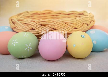 Basket with Easter eggs. Easter eggs lie in the circle of straw basket Stock Photo