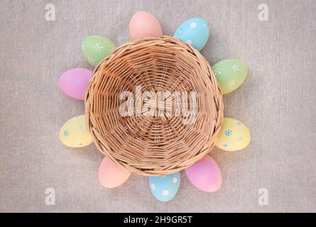 Basket with Easter eggs. Easter eggs lie around the basket Stock Photo
