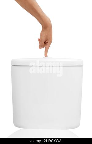 Man hand push toilet flushing button isolated over white background Stock Photo