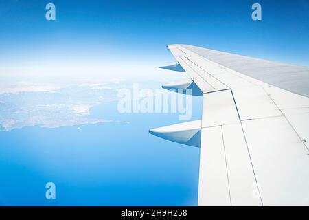 Blue Sky - View from the airplane window. the plane flies over moret view from the window Stock Photo