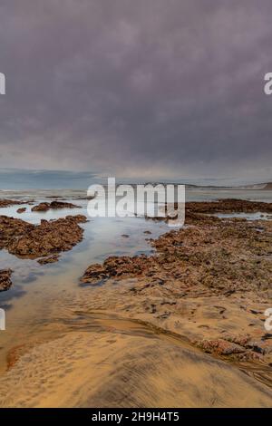 isle of wight coastline, compton bay isle of wight, isle of wight shoreline, low tide and scenery on the beach at compton bay isle of wight coastal. Stock Photo