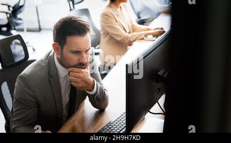 Startup business people group of programmer working as team to find solution to problem Stock Photo