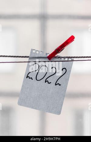 The number 2022 is written on a scrap of notepad. New year 2022. Stock Photo