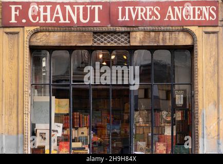 An antique book store window in Paris, France Stock Photo