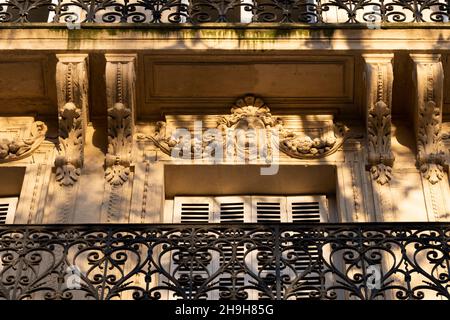 Sculpture above a window on a Beaux Arts building in Paris, France Stock Photo