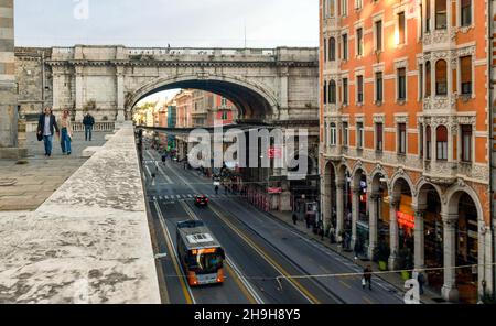 Elevated view of Via XX Settembre from the churchyard of the Church of Santo Stefano with the Monumental Bridge in autumn, Genoa, Liguria, Italy Stock Photo