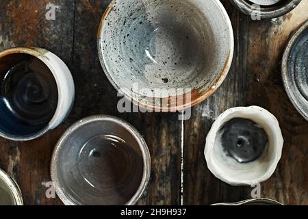 Ceramic tableware on wooden background, top view Stock Photo