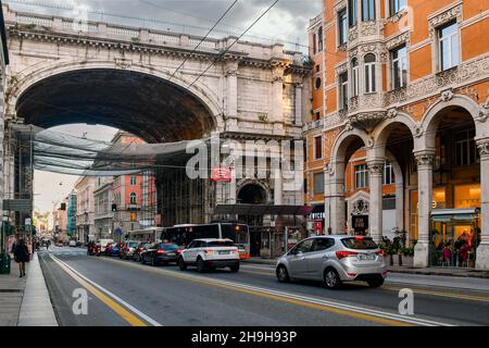 Street view of Via XX Settembre with the Monumental Bridge and a typical porticoed palace, Genoa, Liguria, Italy Stock Photo