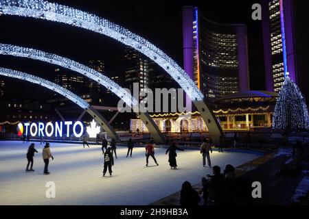 Toronto, Canada - November 30, 2021: Toronto City Hall square is lit up ...
