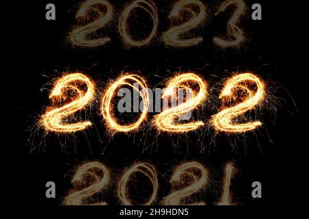 New Year's Eve 2022 of sparklers on a black background. Years Counting Stock Photo