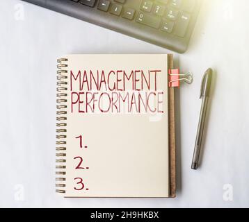 Text sign showing Management Performance. Business overview feedback on Managerial Skills and Competencies Empty Open Journal With A Clip And A Pen