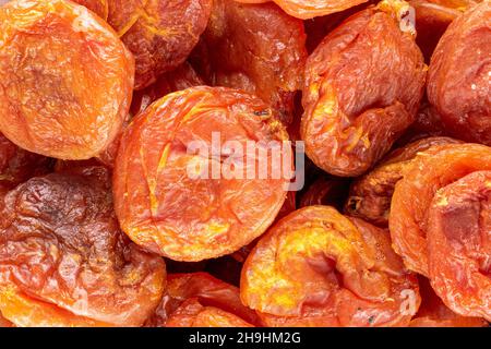 Several sweet dry apricots, close-up, top view. Stock Photo