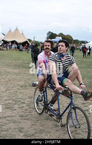 Two men on a tandem bicycle churning ice cream on day 2 of the 10th edition of The End of the Road festival in Larmar Tree Gardens in Dorset Stock Photo Alamy