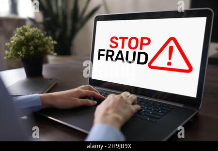 Stop Fraud banner on screen. Cybercrime and internet security concept. Stock Photo
