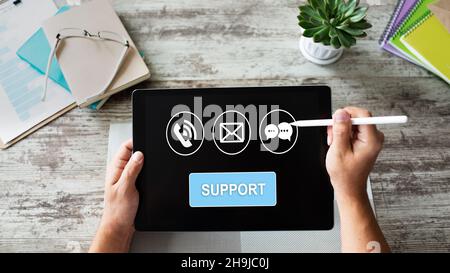 Technical support icons on screen. Call to help center. Internet and technology concept. Stock Photo