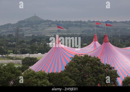 A view of the Tor at Glastonbuy with the John Peel stage in the foreground taken from Hitchen Hill.  From a series of photos taken on the day before Glastonbury 2016 opens to the public. Stock Photo
