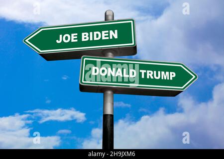 Two direction signs, one pointing left (Joe Biden), and the other one, pointing right (Donald Trump). Stock Photo