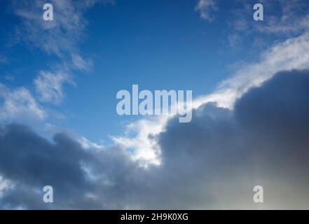 Sun glowing from behind of dark cloud Stock Photo