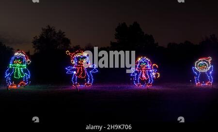 Penguins dressed up as Santa Claus light up at the Fantasy of Lights in Los Gatos, California. Stock Photo
