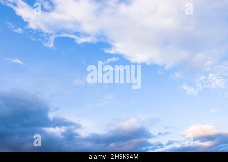 Dramatic storm clouds against a blue sky. Ideal for a climate or environment background Stock Photo