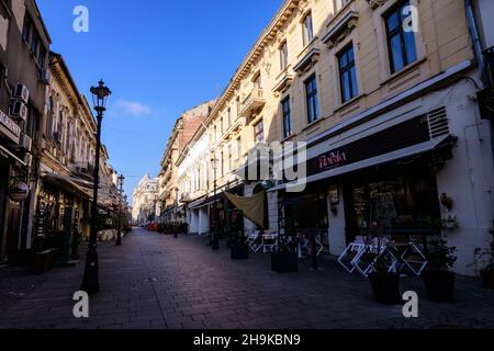 Bucharest, Romania, 22 November 2020 - Street with old buidings in the historic center  on a sunny autumn day Stock Photo