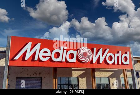 Moncalieri, Turin, Italy - December 6, 2021: Sign with logo of Media World store on the blue sky with clouds, it is stores selling consumer electronic Stock Photo