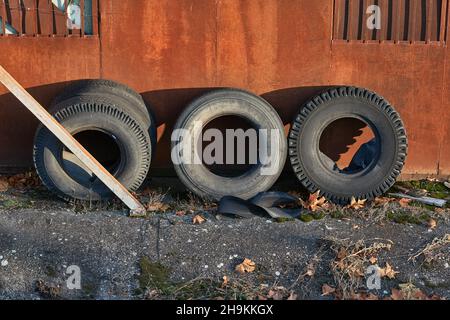 Old truck tyres stored in a junkyard Stock Photo