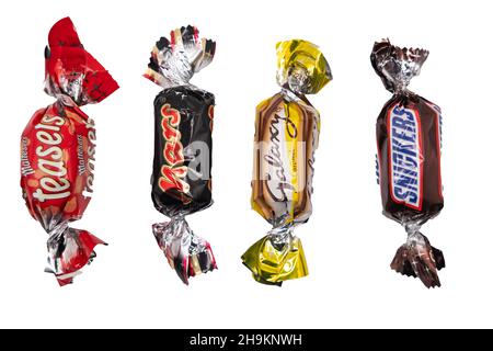 Norwich, Norfolk, UK – December 2021. A fun size Malteser Teaser, Mars, Galaxy Caramel and Snickers cut out and isolated on a plain white background. Stock Photo
