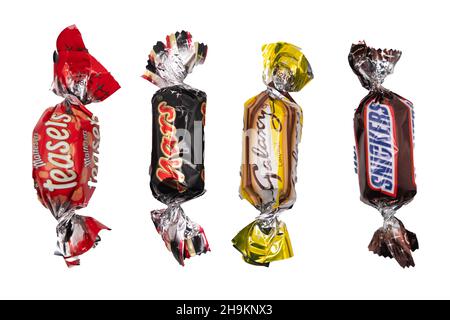 Norwich, Norfolk, UK – December 2021. A fun size Malteser Teaser, Mars, Galaxy Caramel and Snickers cut out and isolated on a plain white background. Stock Photo