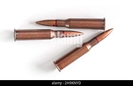 Three copper machine gun bullets isolated on white background Stock Photo