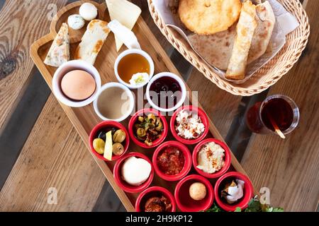 Delicious traditional turkish breakfast with turkish tea on the wooden table. Stock Photo