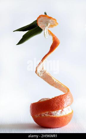 Fresh tangerines with green leaf isolated on white background. Stock Photo