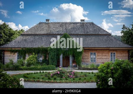 Ciekoty, Poland - July 29, 2021: A traditional wooden house in Swietokrzyskie Mountains. Reconstructed home and museum of polish writer Stefan Zeromski. Stock Photo