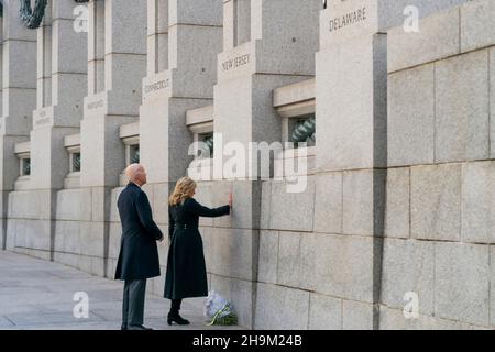 Washington, United States Of America. 07th Dec, 2021. Washington, United States of America. 07 December, 2021. U.S President Joe Biden and First Lady Jill Biden pause to mark the 80th anniversary of the Japanese attack on Pearl Harbor at the World War Two memorial, December 7, 2021 in Washington, DC Credit: Adam Schultz/White House Photo/Alamy Live News