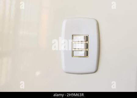 White electric switch on the wall. Brazilian energy crisis. Stock Photo
