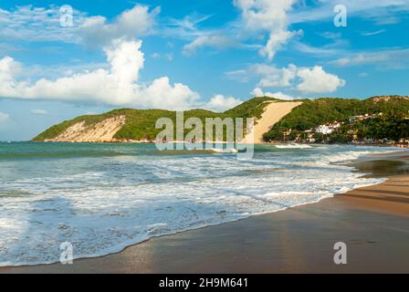 Ponta Negra beach, with Morro do Careca in the background, in the late afternoon, Natal, Rio Grande do Norte, Brazil on February 19, 2008. Stock Photo